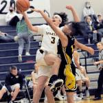 Lonnie Archibald/for Peninsula Daily News Forks Landin Davis attempts a layup during a game against North Beach last season. Davis is set to start for the Spartans this season.
