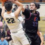 KEITH THORPE/PENINSULA DAILY NEWS East Jeffersons Lorenzo McCleese, right denies a shot by Port Angeles Tyler Hunter during Thursdays game in Port Angeles.