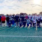 Neah Bay players and coaches gather for a team photo after accepting the Class 1B state football championship second-place trophy. Jodell Wimberly was named the teams Most Sportsmanlike Player for his play in the game by the WIAA. (Michael Carman/Peninsula Daily News)