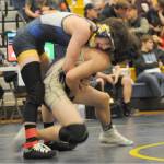 Lonnie Archibald/for Peninsula Daily News
Forks Matthew Montes wrestles Cayden Beauregard of Sequim in the Forks Invitational held Saturday. Montes won his match and his 113-pound weight division.