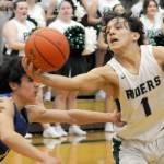 KEITH THORPE/PENINSULA DAILY NEWS
Port Angeles' Kason Albaugh pulls down a loose ball as Bremerton's David Klega, left, tries to push him away during Tuesday's matchup at Port Angeles High School.