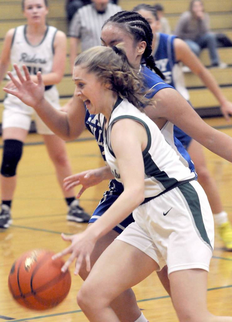 KEITH THORPE/PENINSULA DAILY NEWS Port Angeles Teanna Clark, front, slips past North Masons Adrianna Tupolo during Thursdays game in Port Angeles.