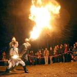 Members of The Fractal Phase, from front, Nova Cain, Pumba Burns and Ahnrix Bishop, breathe fire and preform dance with flames during Saturdays Wintertide Festival of Light at the Port Angeles Fine Arts Center. The event featured music, entertainment, a lantern parade and other yule activities to celebrate the winter solstice. (Keith Thorpe/Peninsula Daily News)