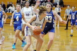 Matthew Nash/Olympic Peninsula News Group
Sequim junior Jolene Vaara keeps her eyes on the basket while defended by Bremerton. Vaara is an Olympic League MVP candidate this season.