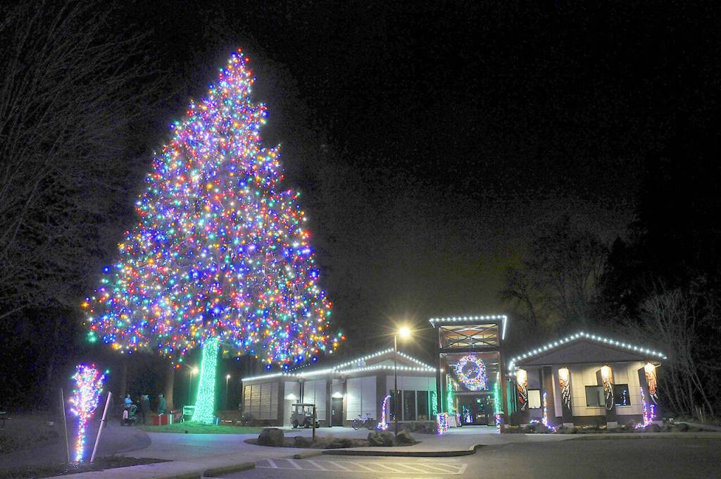 A giant decorated tree stands of the Dungeness River Nature Center at Railroad Bridge Park in Sequim. (Keith Thorpe/Peninsula Daily News)