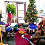 Musicians Jonathan Doyle and Corinne Adams, play a duet during the last day of the Saturday Farmers Market in Uptown Port Townsend. (Steve Mullensky/for Peninsula Daily News)