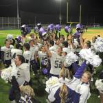Members of the Sequim Wolves football team and cheer squad celebrate Friday nights 36-32 come-from-behind victory over the Port Angeles Roughriders at Port Angeles Civic Field. (Keith Thorpe/Peninsula Daily News)