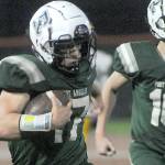 KEITH THORPE/PENINSULA DAILY NEWS
Port Angeles' Jason Hawes, left, takes a punt return from deep in Roughrider territory for a second quarter touchdown against Kingston as teammate Blake Sohlberg follows behind on Friday at Port Angeles Civic Field.