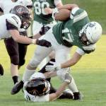 Port Angeles Jason Hawes is brought down by Blaines Riley Ihde and Mallory Messenger, left, in second quarter play on Friday evening in Port Angeles. (Keith Thorpe/Peninsula Daily News)