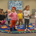 Children particpate in a library activity. (North Olympic Library System)