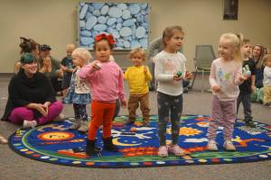 North Olympic Library System
Unidentified children particpate in a library activity.