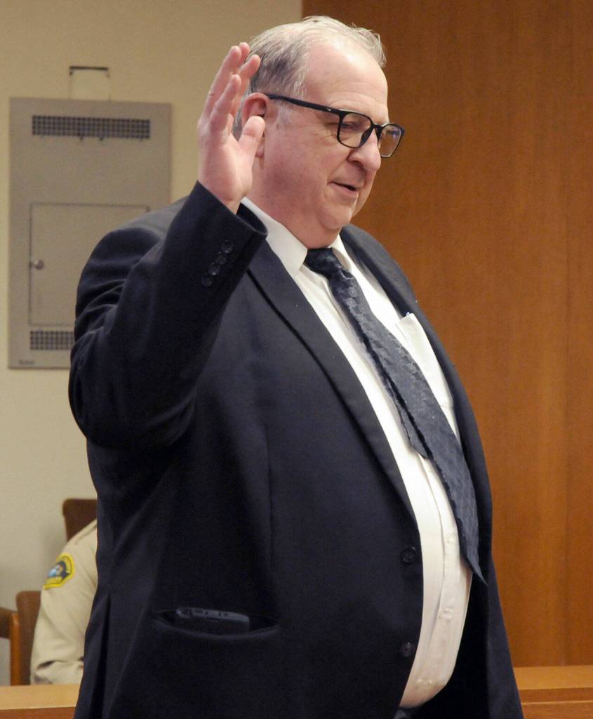 Bruce Hanify takes his oath on Wednesday for District Court 2 Judge. (Keith Thorpe/Peninsula Daily News)
