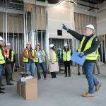 KEITH THORPE/PENINSULA DAILY NEWS
Chris Fidler, project director of the Field Arts and Events Hall, points out features of the under-construction building during a tour with members of the Clallam County Economic Development Council on Friday. The building, part of the much larger Port Angeles Waterfront Center project, will feature a performing arts center, a convention hall, meeting space, a coffee shop and art gallery. PDN Publisher Terry Ward, is chairman of the Clallam County Economic Development Corp. board of directors.