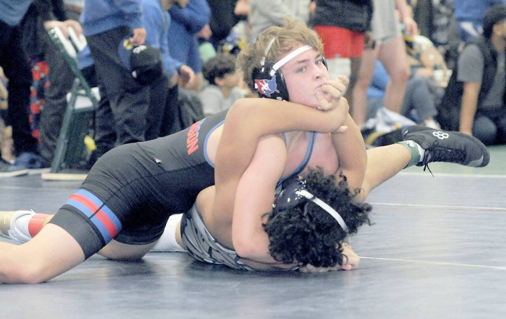 East Jeffersons Jameson Henery, top, takes on Makei-Koa Manalo of River Ridge in the 160-pound bracket on Saturday in Port Angeles. (Keith Thorpe/Peninsula Daily News)