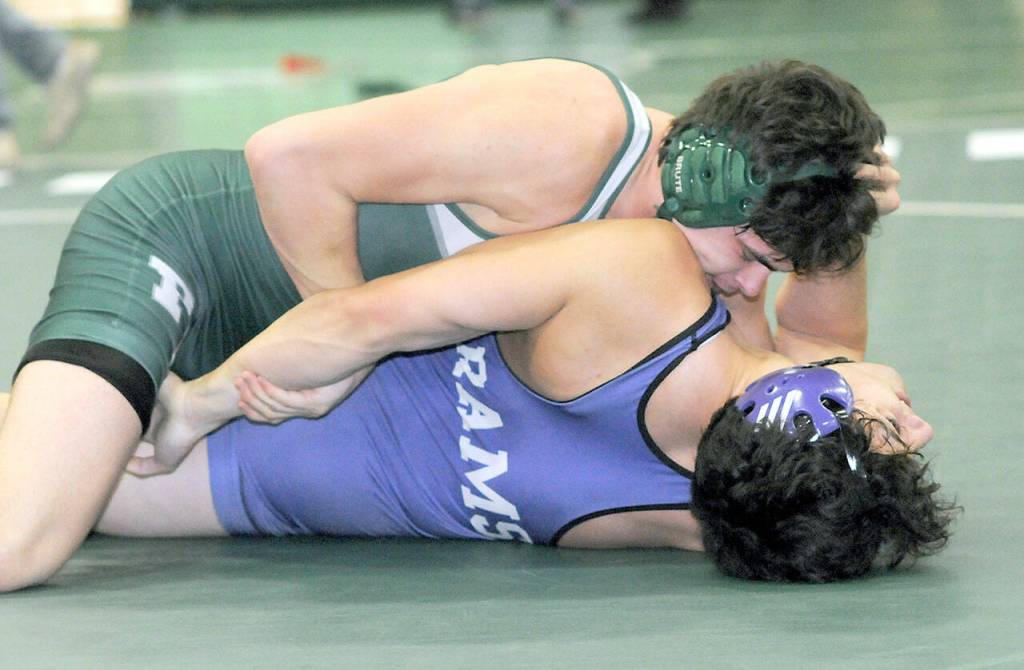 KEITH THORPE/PENINSULA DAILY NEWS
A.J. Martinez Jr., competes with North Thurston's Joseph Ogle in the 170 lb. class on Saturday in Port Angeles.