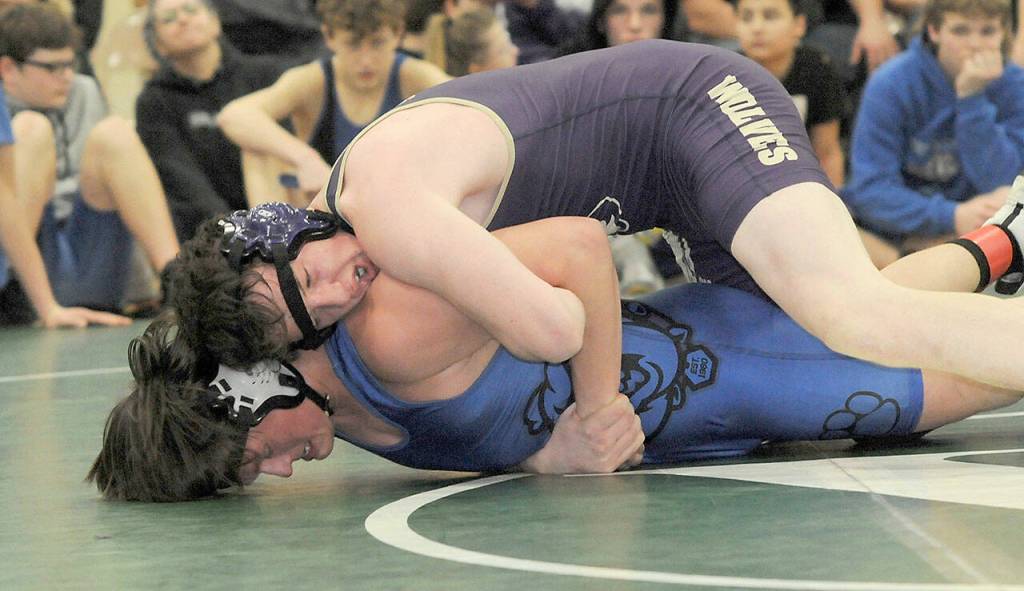 KEITH THORPE/PENINSULA DAILY NEWS
Sequim's Dylan Bowen takes on North Mason's Garcia Stites in the 182 lb. class during Saturday's Battle of the Ax at Port Angeles High School.