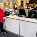 Vivian Hansen, left, will oversee Peninsula Daily News customer service department. She is joined at the front desk by Llewellynn Foulk, center, and Kathleen Boyd. (Alyssa Brown/Peninsula Daily News)
