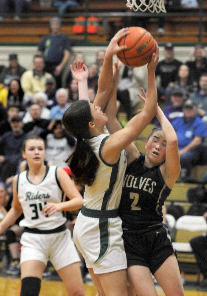 Port Angeles Lindsay Smith, center, and Sequims Hannah Bates fight for a rebound as Port Angeles Lexie Smith looks on at left on Tuesday in Port Angeles. (Keith Thorpe/Peninsula Daily News)