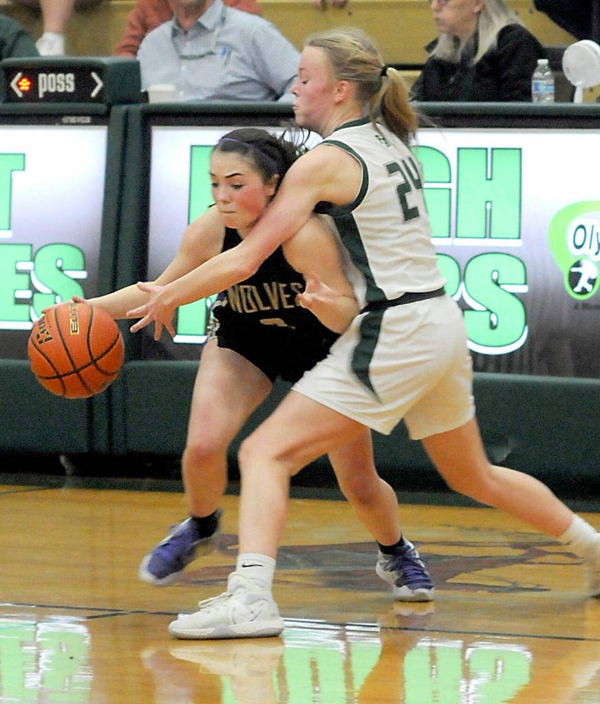 Sequims Hannah Bates gets cut off by Port Angeles Anna Petty during Tuesdays matchup in Port Angeles. (Keith Thorpe/Peninsula Daily News)