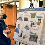 Margaret Groff of Port Townsend is among the scores of people perusing informational panels at Wednesdays open house. (Diane Urbani de la Paz/For Peninsula Daily News)