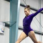 Dave Logan/for Peninsula Daily News
Sequim gymnast Amara Browngirls flies high over the balance beam at the Port Angeles/Sequim-Bainbridge dual meet at Klahhane Gymnastics on Wednesday.