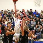 East Jeffersons Stuart Dow outjumps Klahowyas defense for a Rivals basket in Chimacum Friday night. East Jefferson won 49-41 over the Eagles. (Lisa Jensen photo).