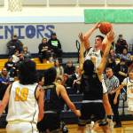 Brody Lausche (22), goes up for a jumper against Chief Leschi earlier this week. Lausche scored 11 points Friday night in a 58-21 victory over North Beach. Also in on the play are the Spartans' Dylan Micheau (10) and Kyle Lohrengel (11).
 (Lonnie Archibald/for Peninsula Daily News)