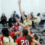 KEITH THORPE/PENINSULA DAILY NEWS
Peninsula's Millie Long, center, aims for the hoop on Wednesday night against Skagit Valley in Port Angeles.