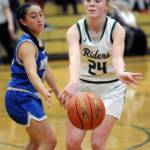 KEITH THORPE/PENINSULA DAILY NEWS Anna Petty of Port Angeles, right, makes a pass as Olympics Mailli Bode looks on during Thursdays game in Port Angeles.