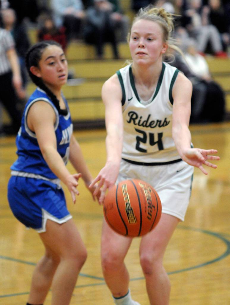 KEITH THORPE/PENINSULA DAILY NEWS Anna Petty of Port Angeles, right, makes a pass as Olympics Mailli Bode looks on during Thursdays game in Port Angeles.