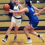 KEITH THORPE/PENINSULA DAILY NEWS Port Angeles Izzy Felton slips around the defense of Olympics Angelina Godinez-Gonzalez during Thursdays game at Port Angeles High School.
