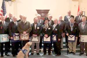 Pictured in the front row, from left to right, are Vance Smith, John Wylie, John Braasch, Gary Zambor, Pete Waldrip, Bob Caruthers, William Smith and Bob Wheeler. 

In the back row, from left to right: Arnie Finley, Winston Cardinez, Bob Jackson, William Schult, Michael Dew, Paul Carmean and Mike Sutherland. 

Sadie is in the foreground.