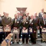 Pictured in the front row, from left to right, are Vance Smith, John Wylie, John Braasch, Gary Zambor, Pete Waldrip, Bob Caruthers, William Smith and Bob Wheeler. In the back row, from left to right: Arnie Finley, Winston Cardinez, Bob Jackson, William Schult, Michael Dew, Paul Carmean and Mike Sutherland. Sadie is in the foreground.