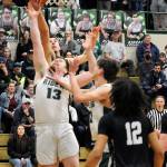 KEITH THORPE/PENINSULA DAILY NEWS Port Angeles Ezra Townsend, front, fights for a rebound with North Kitsaps Cade Orness as Townsends teammate, Tyler Hunter, center right, and North Kitsaps Harry Davies, front, look in on the play on Thursday night in Port Angeles.