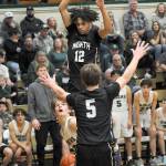 KEITH THORPE/PENINSULA DAILY NEWS Port Angeles Gus Halberg, left, waits for his chance at the basket as North Kitsaps Harry Davies, top, and Ethan Gillespie provide interference on Thursday at Port Angeles High School.