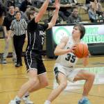 Keith Thorpe/Peninsula Daily News Port Angeles Parker Nickerson, right, looks for an opening around the defense of North Kitsaps Ethan Gillespie on Thursday night in Port Angeles.