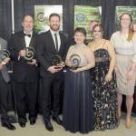 Port Angeles Community Award recipients gather after Saturday nights fifth annual awards gala, including, from left, Joe DeScala, representing 4PA, organization of the year; Dr. Gerald Stephanz, citizen of the year; Tommy Harris, young leader of the year; Natalie Snow, Katelyn Sheldon and Andrea Dean, representing Wellys Real Fruit Ice Cream, emerging business of the year; and Hayley Sharpe, owner of MOSS, business of the year. Not present was John Gallagher, educator of the year. The awards are produced by the Port Angeles Chamber of Commerce and sponsored by Sound Publishing. (Keith Thorpe/Peninsula Daily News)