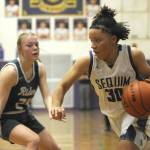 Sequim's Bobbi Mixon drives the ball against Port Angeles' Anna Petty in Thursday's game in Sequim. The Wolves won 57-46 thanks to a big third quarter. (Michael Dashiell/Olympic Peninsula News Group)