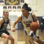 Sequims Bobbi Mixon drives the ball against Port Angeles Anna Petty in Thursdays game in Sequim. The Wolves won 57-46 thanks to a big third quarter. (Michael Dashiell/Olympic Peninsula News Group)