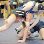 KEITH THORPE/PENINSULA DAILY NEWS
Fork's Miley Blanton, top, takes on Grace Odun of River Ridge in the 119 lb. class on Saturday at Port Angeles High School.