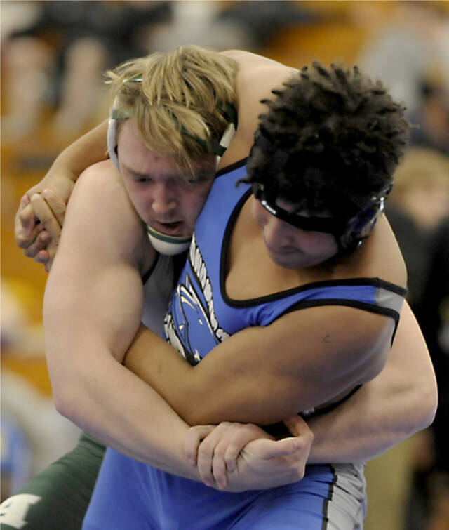 Thomas Arand of Port Angeles, left, wrestles Gabriel Happli of Olympic in the 182-pound weight class of the Olympic League subregional tournament in Bremerton on Saturday. Arand won the match and placed third overall, advancing to the regional tournament. (Michael Dashiell/Olympic Peninsula News Group)