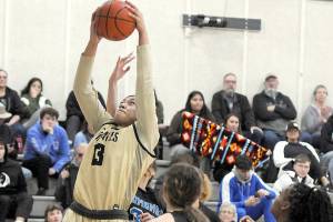 Keith Thorpe/Peninsula Daily News
Peninsula's Ituau Tulsaula reaches for the hoop as Edmonds defenders, from left, Leilani Motta, Aspen Carter and Danielle Woods look on during Saturday's game in Port Angeles.