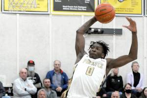 Keith Thorpe/Peninsula Daily News
Peninsula's Ese Onakpoma goes up for the jam against Bellevue on Wednesday night in Port Angeles.