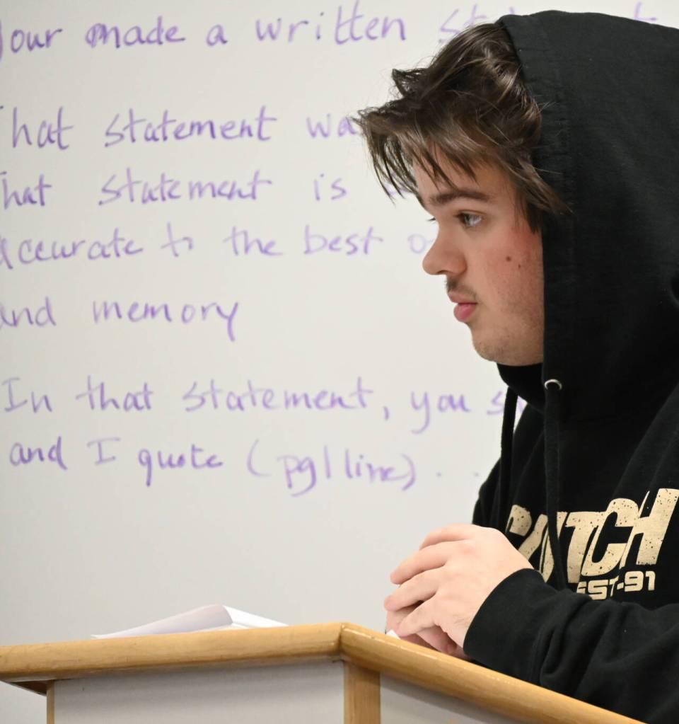 Finn Marlow scrutinizes a witness during a Mock Trial club practice last week. (Michael Dashiell/Olympic Peninsula News Group)