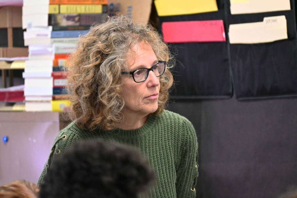 Susan Fisch listens on as Sequim High School students in the schools first Mock Trial club practice last week. (Michael Dashiell/Olympic Peninsula News Group)