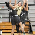 Peninsulas Jenilee Donovan, center, gets squeezed between Shorelines Moemanogi Notoa, left, and Katelyn Altaha on Saturday at Peninsula College. (Keith Thorpe/Peninsula Daily News)