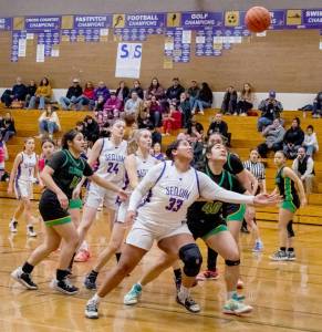 Sequims Jelissa Julmist battles with Clover Parks Alicia-Ellalynn Solai for a rebound in Tuesdays District 2/3 first-round tournament game. Sequim went on a 23-0 run in the third quarter en route to a 65-29 win and has already qualified for the state 2A tournament. (Emily Matthiessen/Olympic Peninsula News Group)