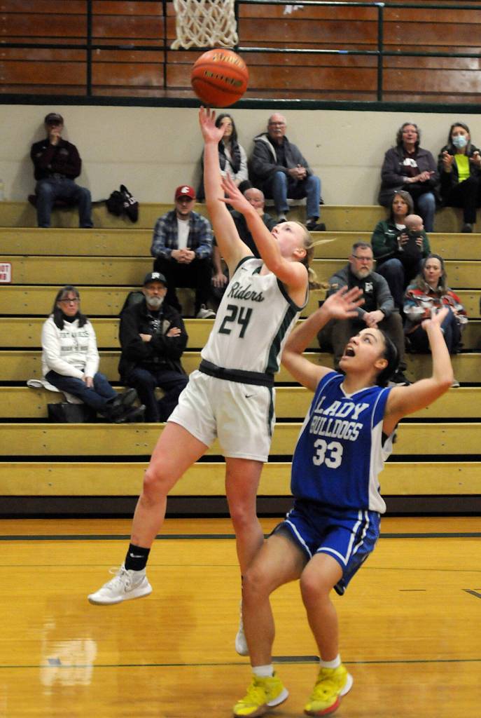 Keith Thorpe/Peninsula Daily News Port Angeles Anna Petty goes for an easy breakaway layup as North Masons Adrianne Tupolo tries to keep up on Thursday at Port Angeles High School.