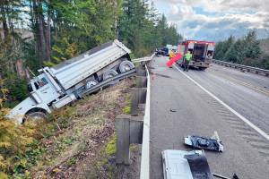 A dump truck was sent over the embankment on state Highway 104 near state Highway 19 when two pickups were involved in a glancing head-on collision shortly before 11 a.m. 
Jefferson County Sheriff's Office