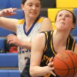 Forks Keira Johnson looks for the hoop as Crescents Kaylen Mason defends in Joyce in late December. Johnson made the Pacific 2B League first team. (Keith Thorpe/Peninsula Daily News)